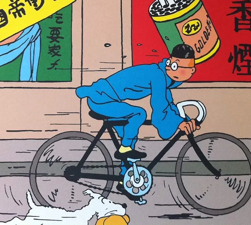 Tintín, en bicicleta.